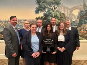 Eccleston and Wolf attorneys pose for a photo after accepting an award for Law Firm of the Year.